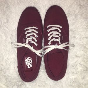 Burgundy vans.